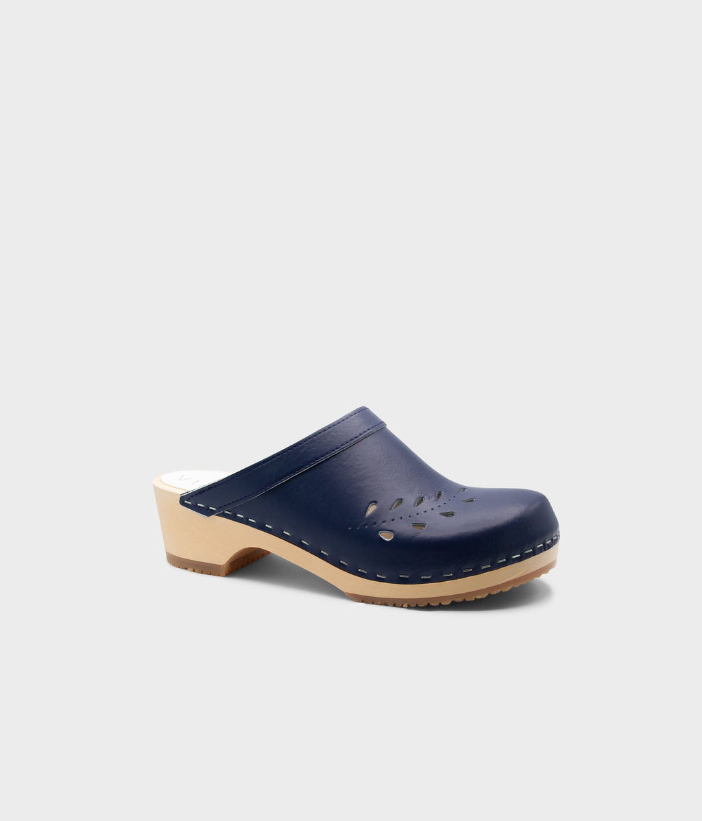 Navy blue wooden clog shoe on a light gray background