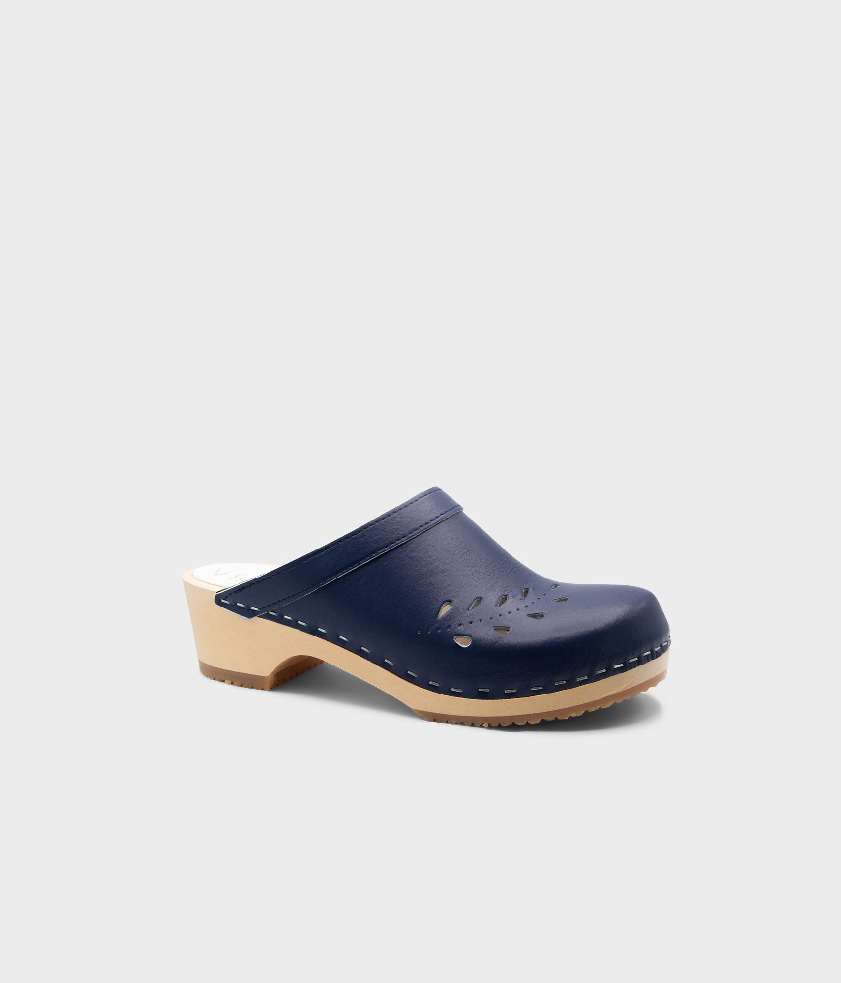 Navy blue wooden clog shoe on a light gray background