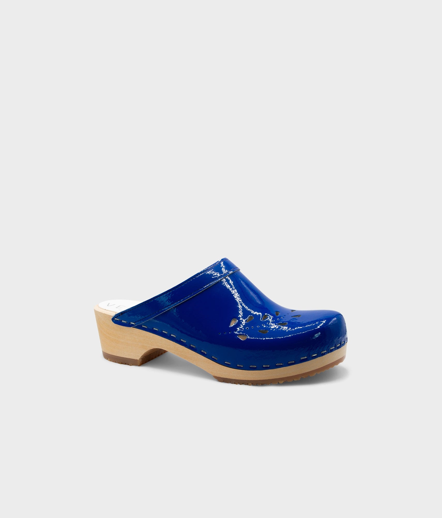Blue clog shoe on a light gray background