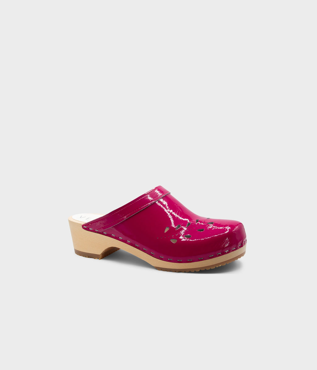 Pink clog shoe on a light gray background