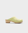 Light green clog shoe on a white background