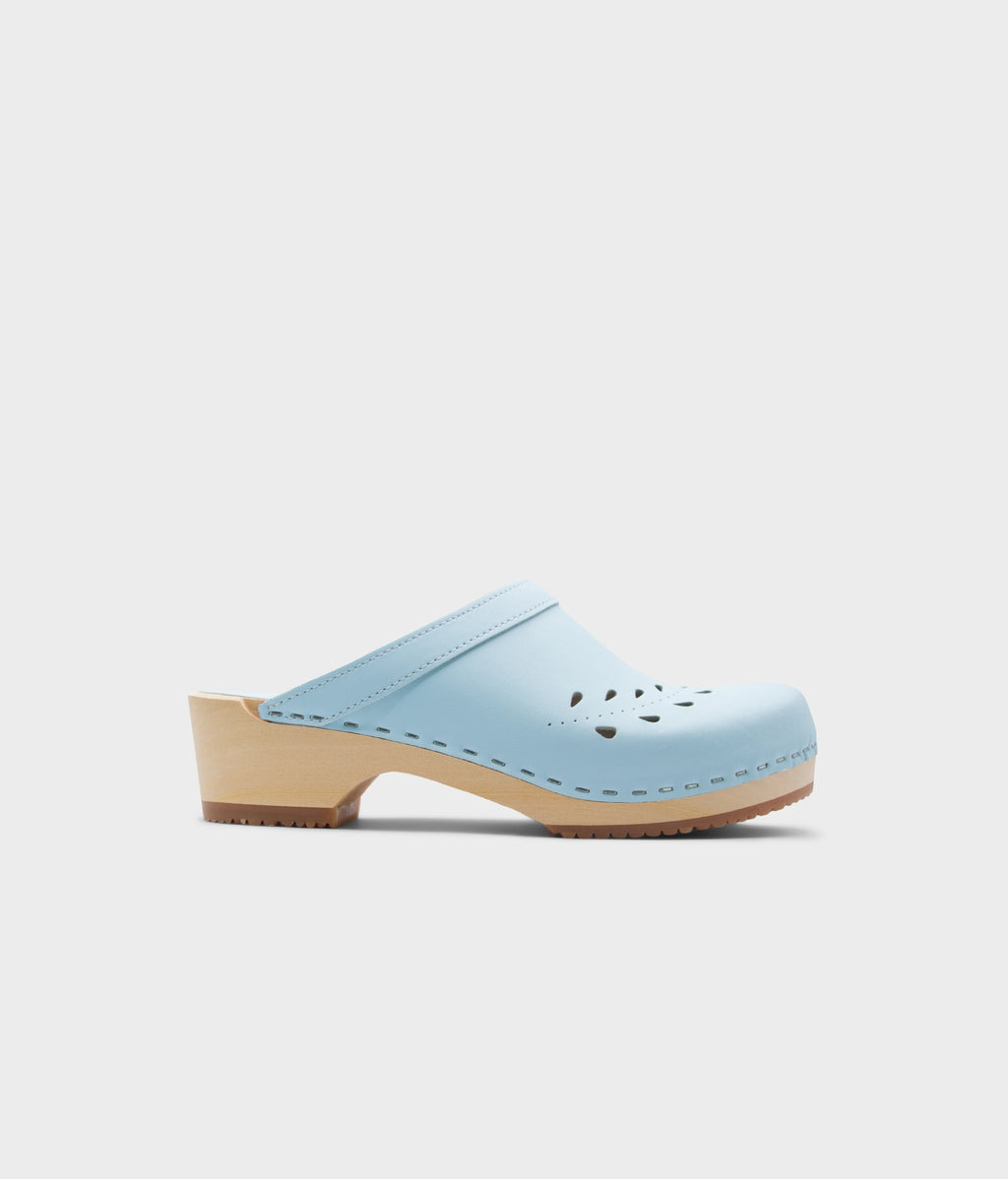 Light blue clog shoe on a white background