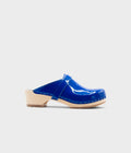 Blue clog mule on a light gray background