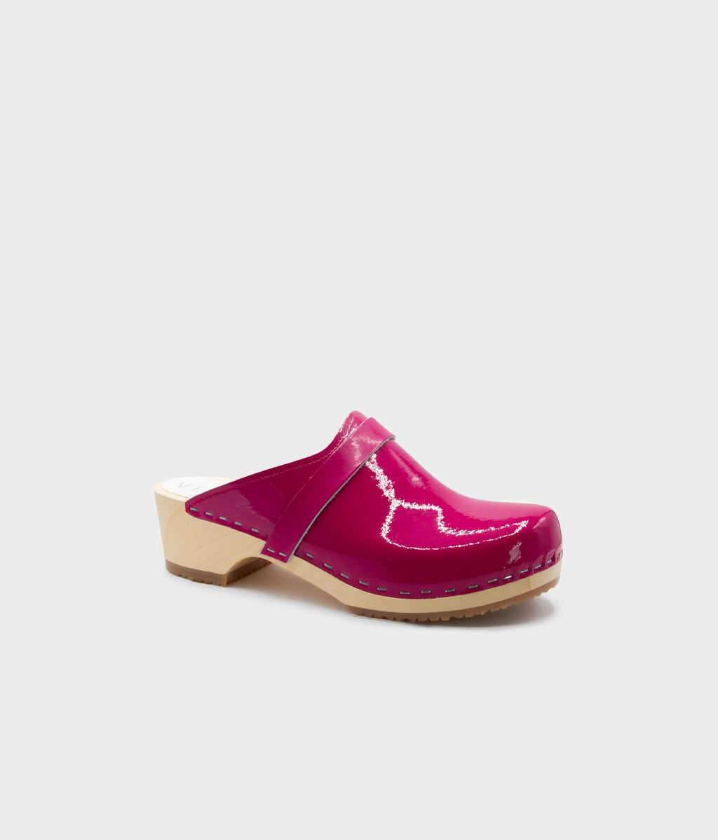 Pink clog mule on a light gray background