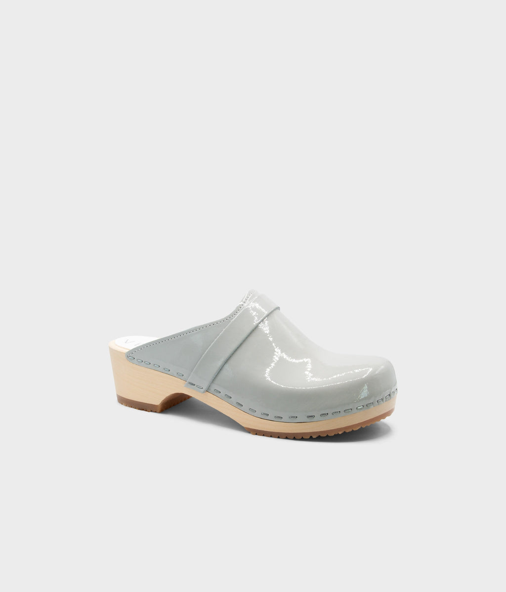 Light grey clog shoe on a white background