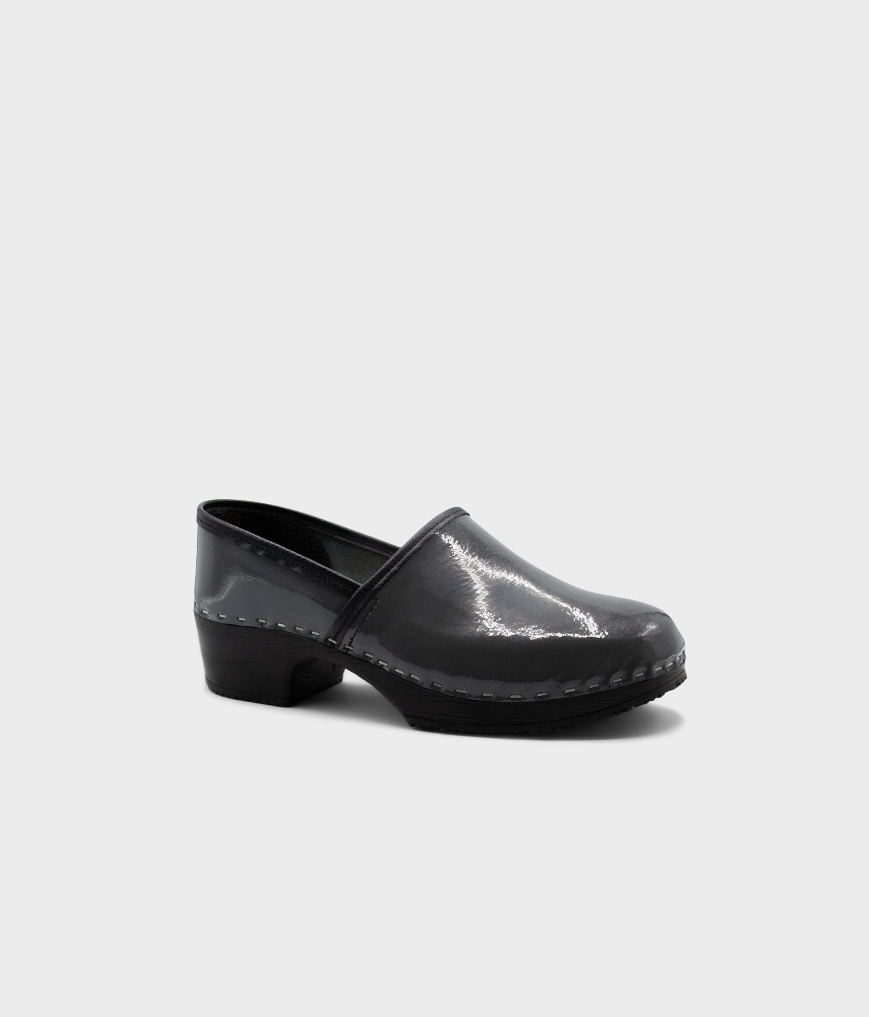 Black clog shoe on a white background