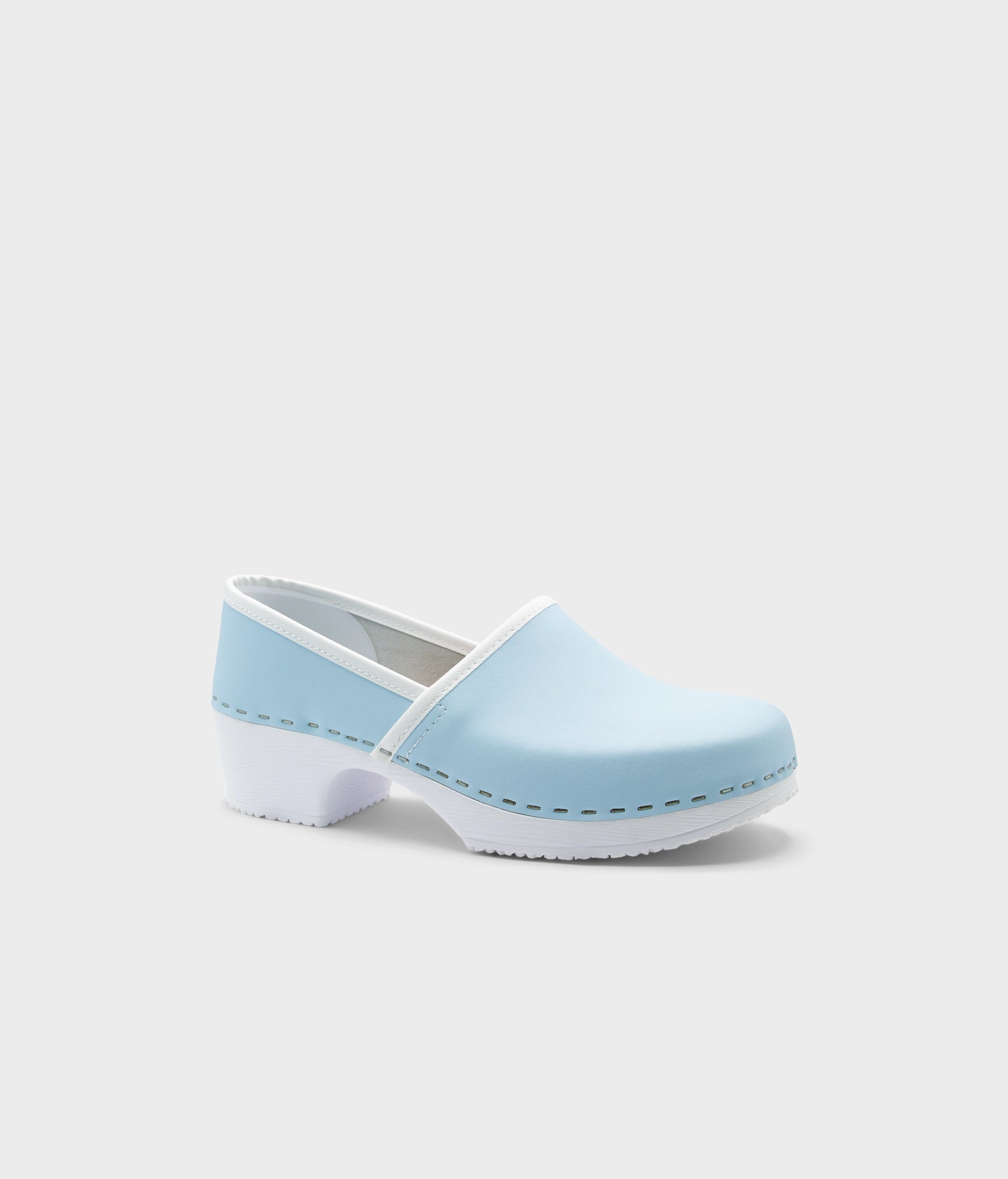 Light blue clog shoe on a white background