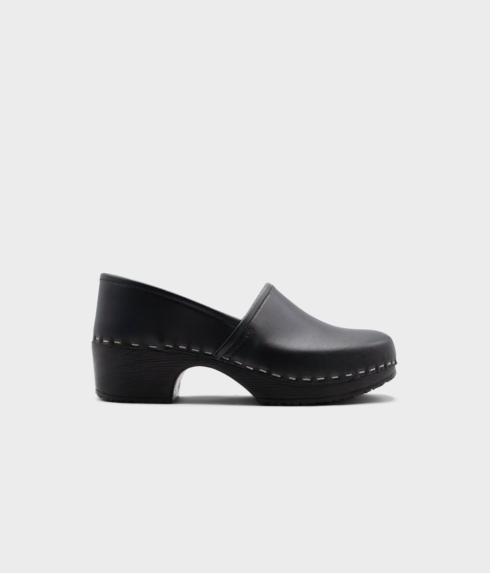 Black clog shoe on a white background