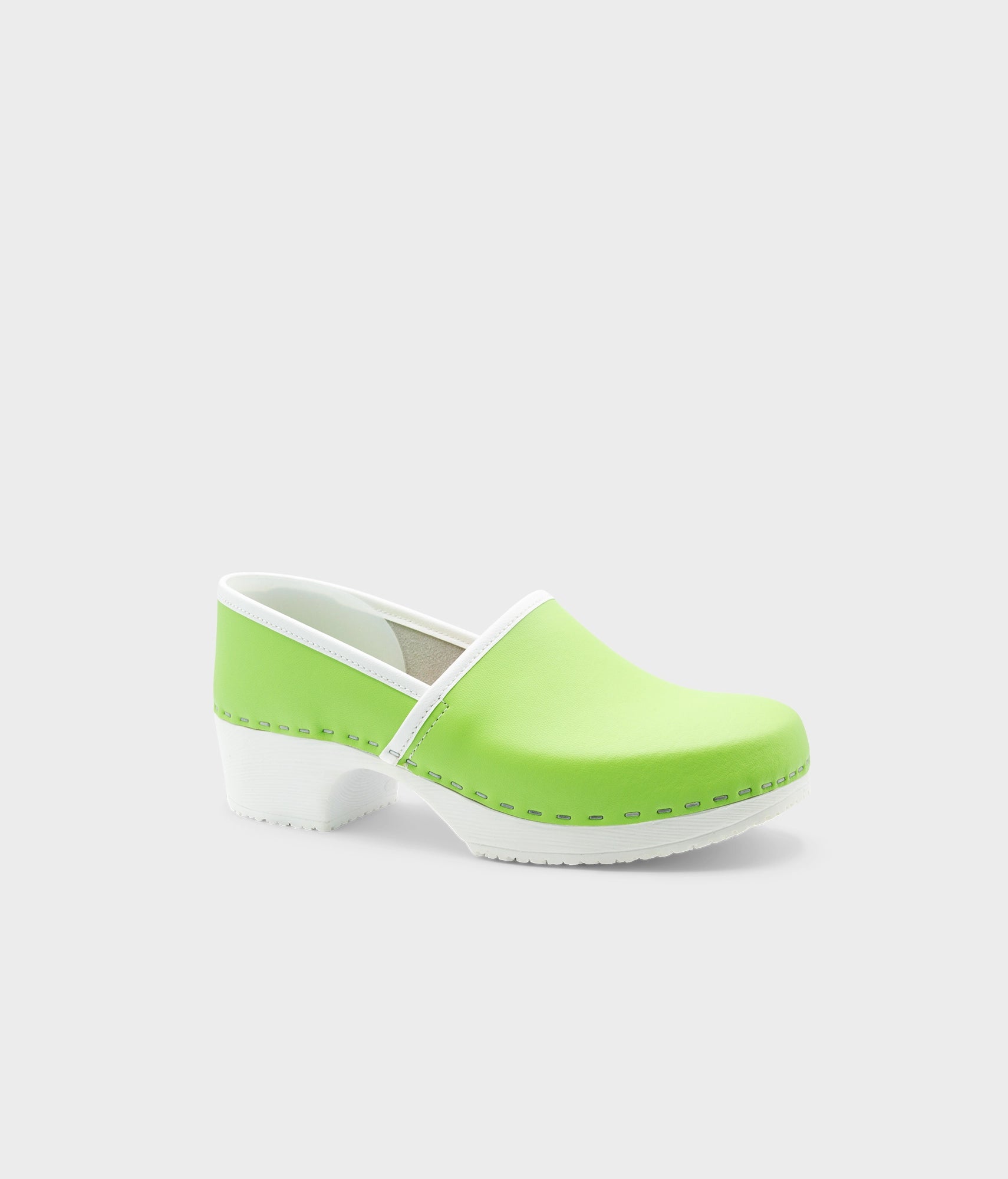 Green clog shoe on a white background