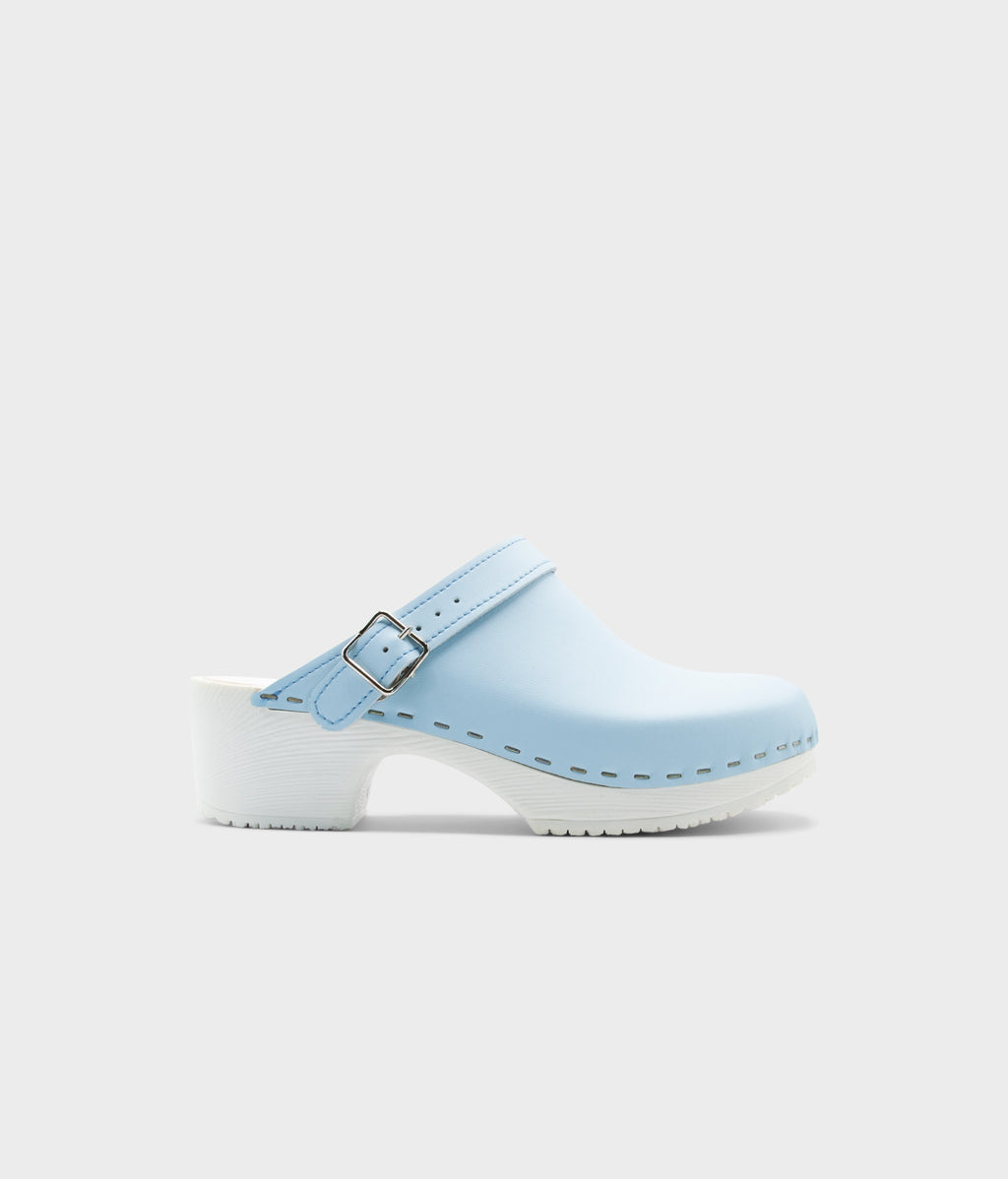 Light blue clog shoe on a white background