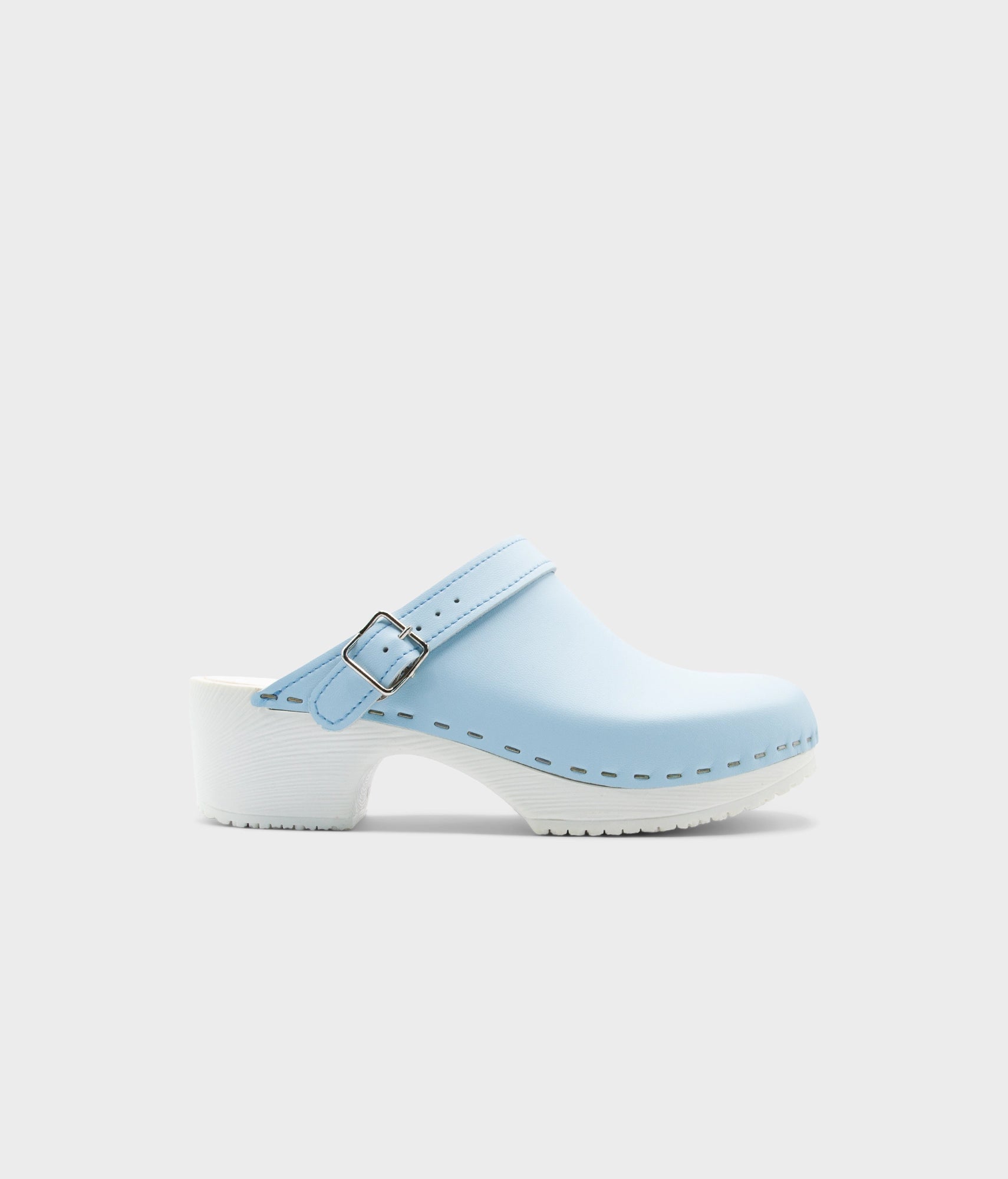 Light blue clog shoe on a white background