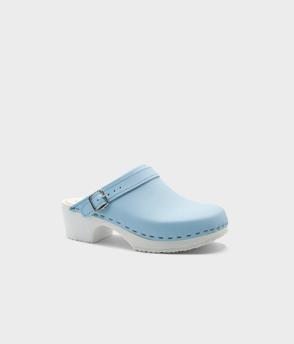 Light blue clog shoe on a white background