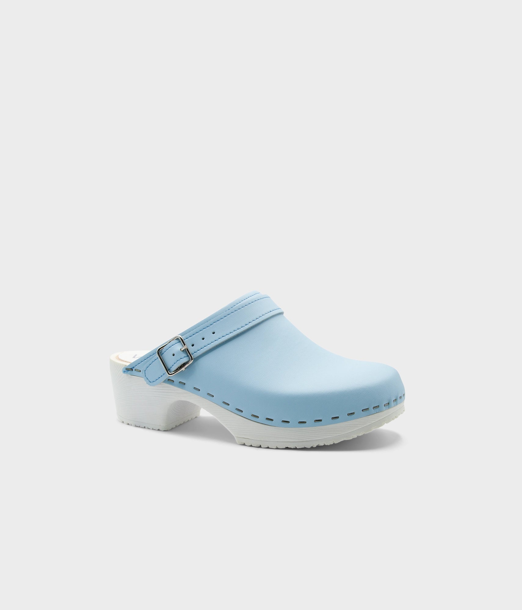 Light blue clog shoe on a white background