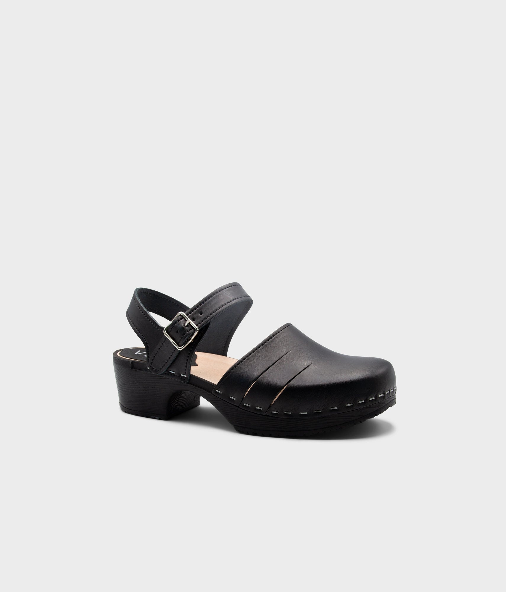 Black clog shoe on a white background