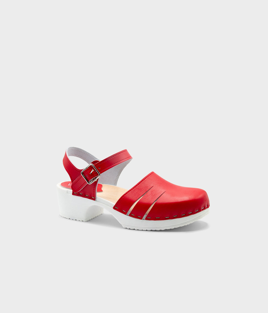 Red clog shoe on a light gray background