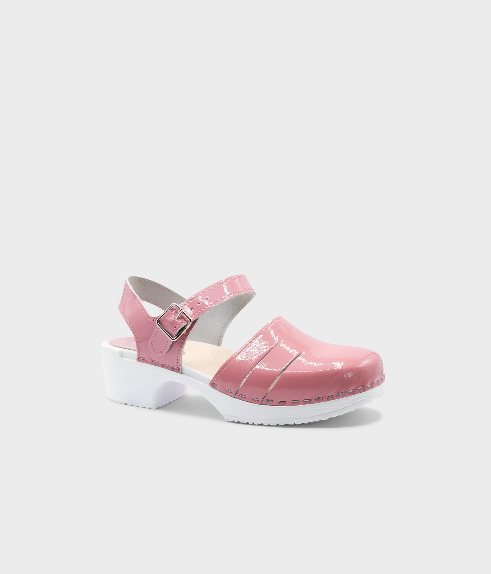 Pink clog shoe on a white background